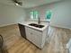 Kitchen island with a stainless steel sink, marble countertop, and modern cabinetry at 219 Pine St, Rockwell, NC 28138