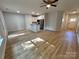 Spacious open-concept living room and kitchen with light hardwood flooring and stainless steel appliances at 219 Pine St, Rockwell, NC 28138