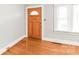 Welcoming entryway showcases natural wood door and hardwood flooring at 2722 Eastway Dr, Charlotte, NC 28205