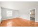 Bright living room featuring beautiful hardwood floors and fresh, neutral paint at 2722 Eastway Dr, Charlotte, NC 28205