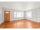 Well-lit living room with hardwood floors and bright windows at 2722 Eastway Dr, Charlotte, NC 28205