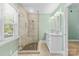 Bathroom featuring glass enclosed shower, double vanity and neutral finishes at 2800 Georgia Ave, Charlotte, NC 28205