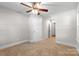 Unfurnished bedroom offering neutral carpeting, a ceiling fan, and an closet at 2800 Georgia Ave, Charlotte, NC 28205
