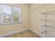 Walk-in closet with wire shelving and natural light, offering ample storage space at 2800 Georgia Ave, Charlotte, NC 28205