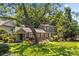Charming two-story home featuring a covered front porch, mature trees, and well-maintained landscaping at 2800 Georgia Ave, Charlotte, NC 28205