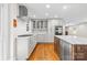 Well-appointed kitchen featuring stainless steel appliances, marble counters and white subway tile backsplash at 2800 Georgia Ave, Charlotte, NC 28205