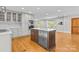 Modern kitchen featuring gray cabinets, stainless steel appliances, and a spacious center island at 2800 Georgia Ave, Charlotte, NC 28205