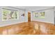 Spacious living room with hardwood floors, large windows, and natural light at 2800 Georgia Ave, Charlotte, NC 28205