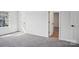 Neutral bedroom featuring carpet, neutral walls and open door to another room at 2899 Atwater Pond Cir, Denver, NC 28037