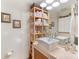 Bright bathroom with modern sink, wooden shelving, and decorative towels and baskets at 297 Mcdonald Ave, Charlotte, NC 28203