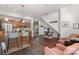 Modern kitchen area featuring stainless steel appliances and a breakfast bar with stylish seating, great for casual dining at 297 Mcdonald Ave, Charlotte, NC 28203