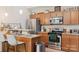 Functional kitchen with stainless steel appliances, granite countertops, and an adjacent open living space at 297 Mcdonald Ave, Charlotte, NC 28203