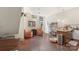 Open-concept living area with stylish chairs, kitchen island, and polished floors, offering a modern and inviting space at 297 Mcdonald Ave, Charlotte, NC 28203