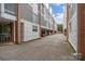 Row of modern townhomes with covered parking and brick and siding facades at 297 Mcdonald Ave, Charlotte, NC 28203