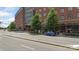 Street view of modern brick mixed-use building with retail storefronts and apartments at 297 Mcdonald Ave, Charlotte, NC 28203
