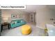 Cozy bonus room featuring a comfortable sofa, ottoman, and desk for a flexible living space at 3122 Spring Iris Dr, Denver, NC 28037