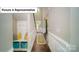 Inviting entryway with hardwood floors, a built-in bench, and stylish decor creates a warm first impression at 3122 Spring Iris Dr, Denver, NC 28037