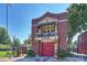Historic fire station with red brick facade, balcony, and red garage doors at 3519 Card St, Charlotte, NC 28205