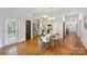 Bright dining area with hardwood floors, adjacent to the kitchen with stainless steel appliances at 3519 Card St, Charlotte, NC 28205