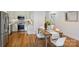 Open kitchen and dining area with stainless steel appliances, and stainless steel backsplash at 3519 Card St, Charlotte, NC 28205
