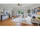 Inviting living room with hardwood floors, large windows, cozy seating, and stylish decor at 3519 Card St, Charlotte, NC 28205
