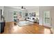 Bright and airy living room boasting hardwood floors, ample natural light, and a comfortable seating arrangement at 3519 Card St, Charlotte, NC 28205