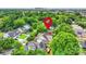 Scenic aerial view of green neighborhood with downtown city skyline in the distance and subject property marked at 3519 Card St, Charlotte, NC 28205