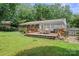 Backyard view showcasing deck with seating and grill at 3612 Trent St, Charlotte, NC 28209