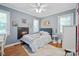 Cozy bedroom with hardwood floors and natural light at 3612 Trent St, Charlotte, NC 28209