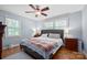 Comfortable bedroom with hardwood floors, ceiling fan, and lots of natural light at 3612 Trent St, Charlotte, NC 28209