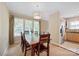 Open dining room with a wooden table and chairs, adjacent to the kitchen at 3612 Trent St, Charlotte, NC 28209
