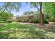 Traditional brick home featuring a beautiful lawn, mature trees, and classic architectural details at 3612 Trent St, Charlotte, NC 28209