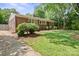 Charming brick home with a well-manicured front yard and mature tree at 3612 Trent St, Charlotte, NC 28209
