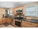 Well-lit kitchen with stainless steel appliances and light wood cabinetry at 3612 Trent St, Charlotte, NC 28209