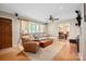 Cozy living room with hardwood floors, comfortable seating, and natural light at 3612 Trent St, Charlotte, NC 28209