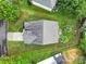 Aerial shot of a house with a large roof, green lawn, and beautiful landscaping at 3908 Parkers Ferry Rd, Fort Mill, SC 29715