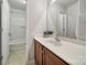 Bathroom featuring a vanity with wood cabinets, a shower-tub and a large mirror at 3908 Parkers Ferry Rd, Fort Mill, SC 29715