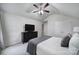 Bedroom featuring a ceiling fan, carpet, neatly made bed, and television atop a black dresser at 3908 Parkers Ferry Rd, Fort Mill, SC 29715