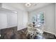 Bright breakfast nook featuring a round table and chairs, complemented by natural light from the window at 3908 Parkers Ferry Rd, Fort Mill, SC 29715