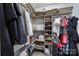 Walk-in closet with custom shelving and organization for clothes and accessories at 3908 Parkers Ferry Rd, Fort Mill, SC 29715