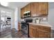 Well-equipped kitchen with stainless steel appliances, warm wood cabinets, and stylish backsplash at 3908 Parkers Ferry Rd, Fort Mill, SC 29715