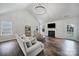 Spacious living room with vaulted ceiling, fireplace, and large windows for natural light at 3908 Parkers Ferry Rd, Fort Mill, SC 29715