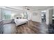 Large main bedroom with wood-look floors, tray ceiling, and a walk-in closet at 3908 Parkers Ferry Rd, Fort Mill, SC 29715