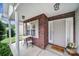 Inviting front porch with brick accents, features a cozy seating area perfect for relaxing at 3908 Parkers Ferry Rd, Fort Mill, SC 29715