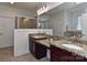 Bright bathroom featuring granite countertops and double sinks with a window and shower at 3913 Widgeon Way, Waxhaw, NC 28173