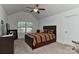 Bedroom with vaulted ceiling, a window letting in natural light, and a bed with dark wood frame at 3913 Widgeon Way, Waxhaw, NC 28173