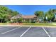 Community clubhouse with covered seating area, manicured landscaping, and convenient parking at 3913 Widgeon Way, Waxhaw, NC 28173