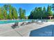 Large community pool with plenty of deck chairs and lounge seating, perfect for relaxing in the sun at 3913 Widgeon Way, Waxhaw, NC 28173