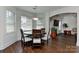 Charming dining room filled with natural light and hardwood flooring throughout at 3913 Widgeon Way, Waxhaw, NC 28173