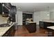 Modern kitchen with stainless steel appliances, granite countertops, and island at 3913 Widgeon Way, Waxhaw, NC 28173